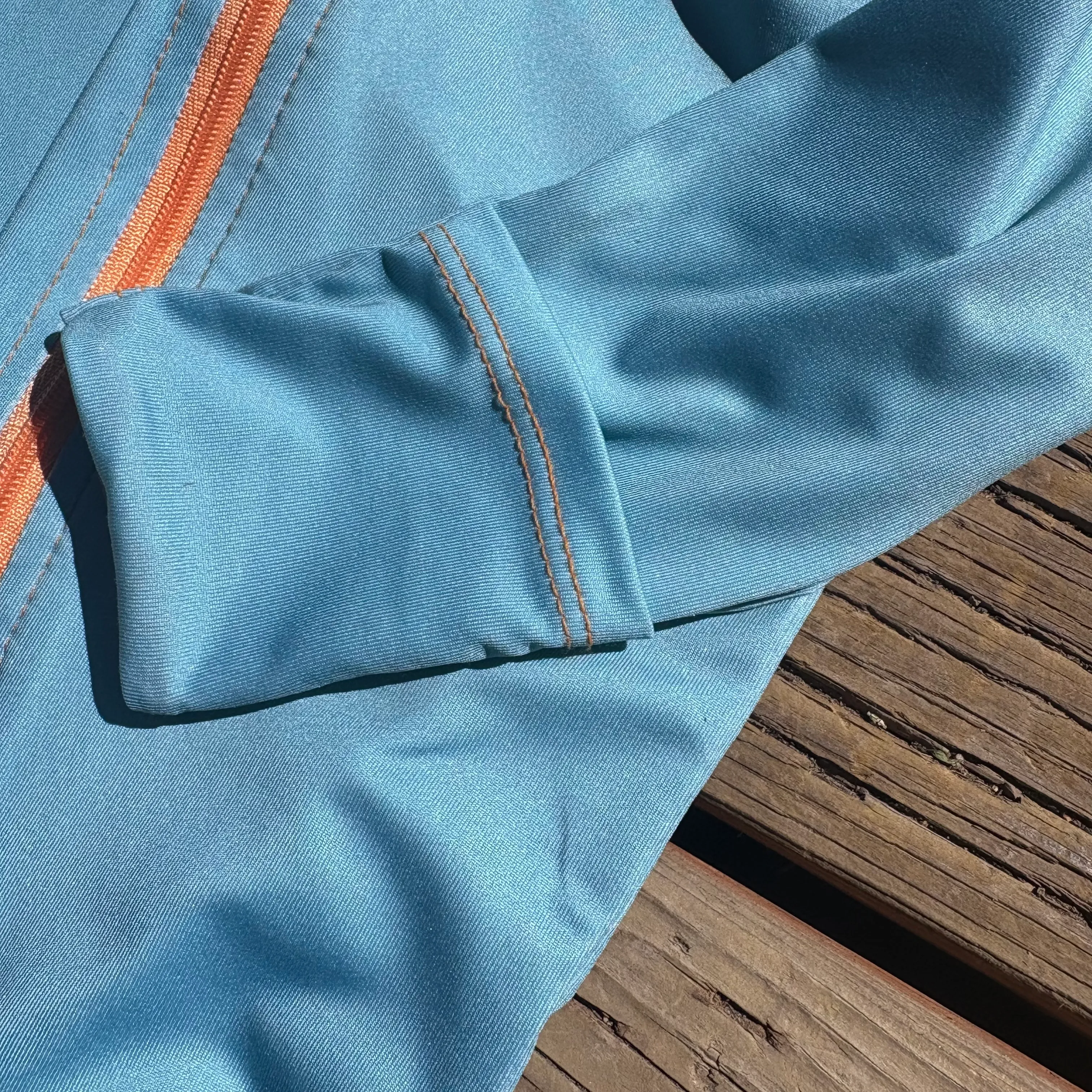 Close-up of the breathable TrailTog UPF 50+ sun suit sleeve cuff in outdoor sunlight