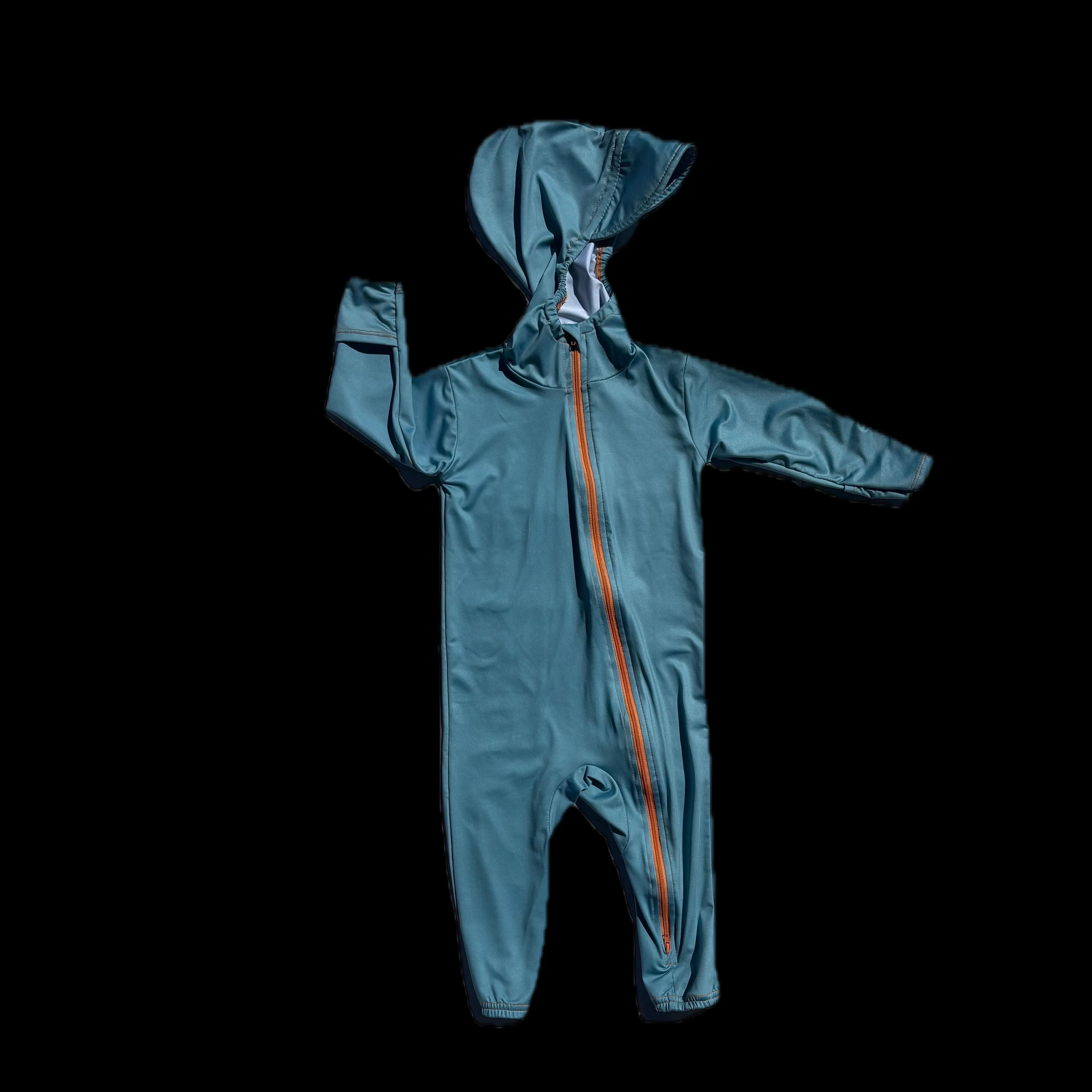 Flat lay of the Ocean Mist blue TrailTog UPF 50+ sun suit shown against a dark background