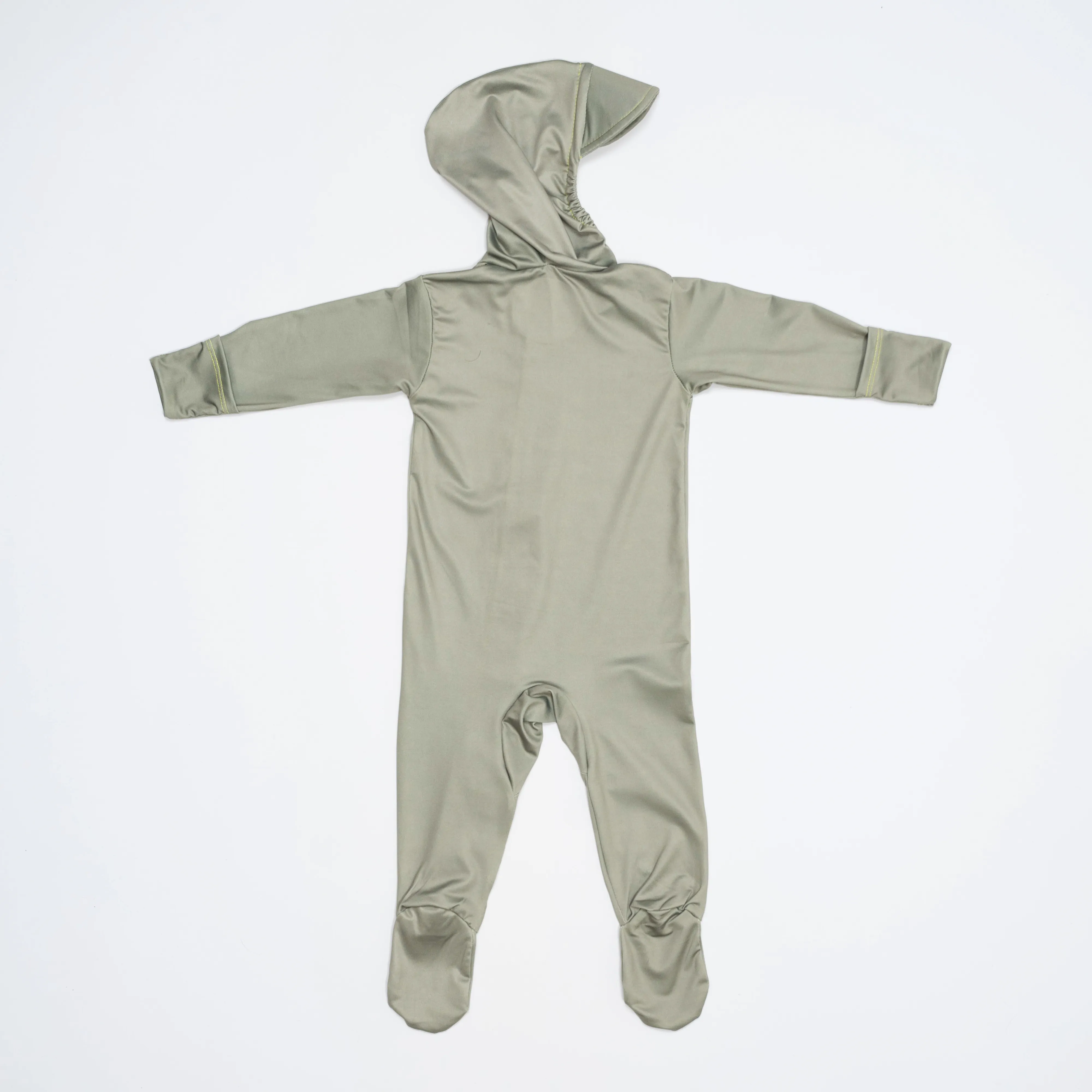 Flat lay of the back of the sage green TrailTog UPF 50+ sun suit showing the integrated hood and footies that reduce exposed skin